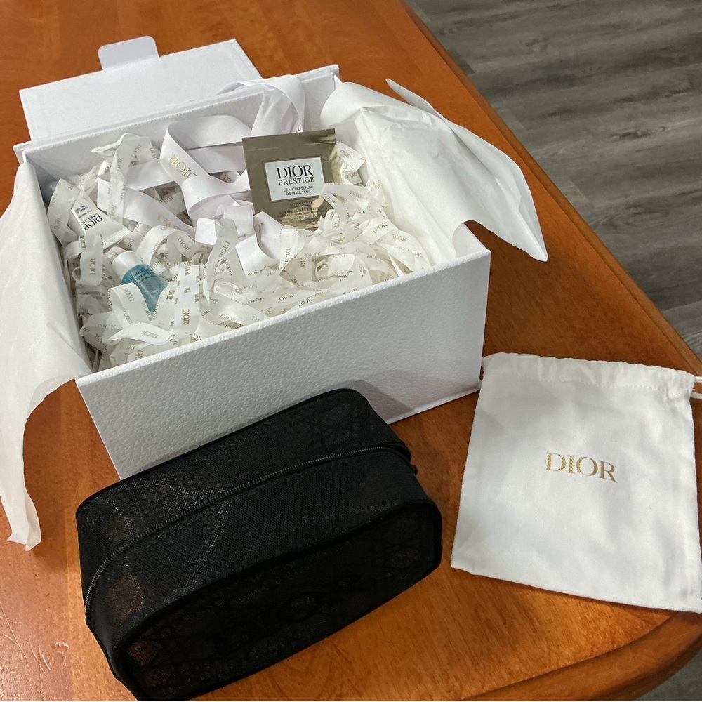 Dior gift box with samples and black mesh cosmetic zipper pouch
